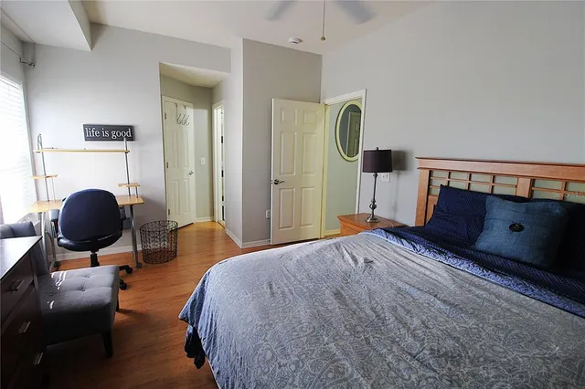 a bedroom with a bed and cabinets