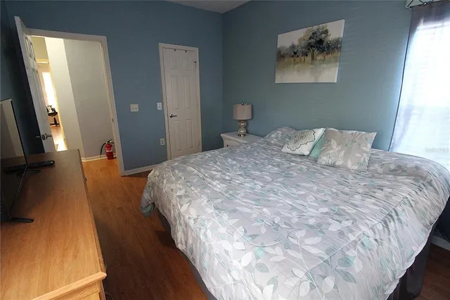 a bedroom with bed and a window