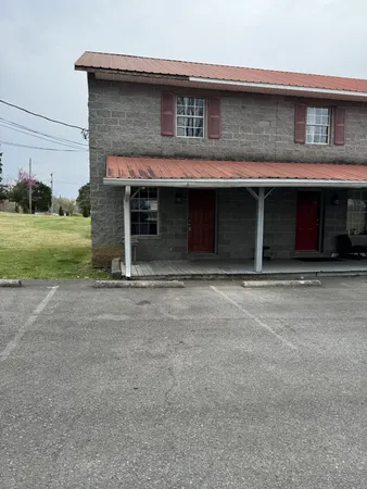 a view of building with yard