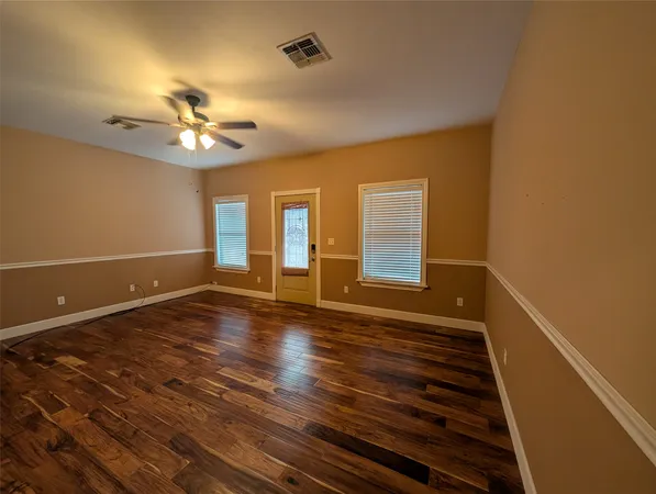 a view of a livingroom with wooden floor