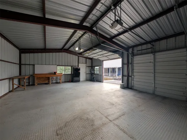 a view of a room with lots of wooden furniture