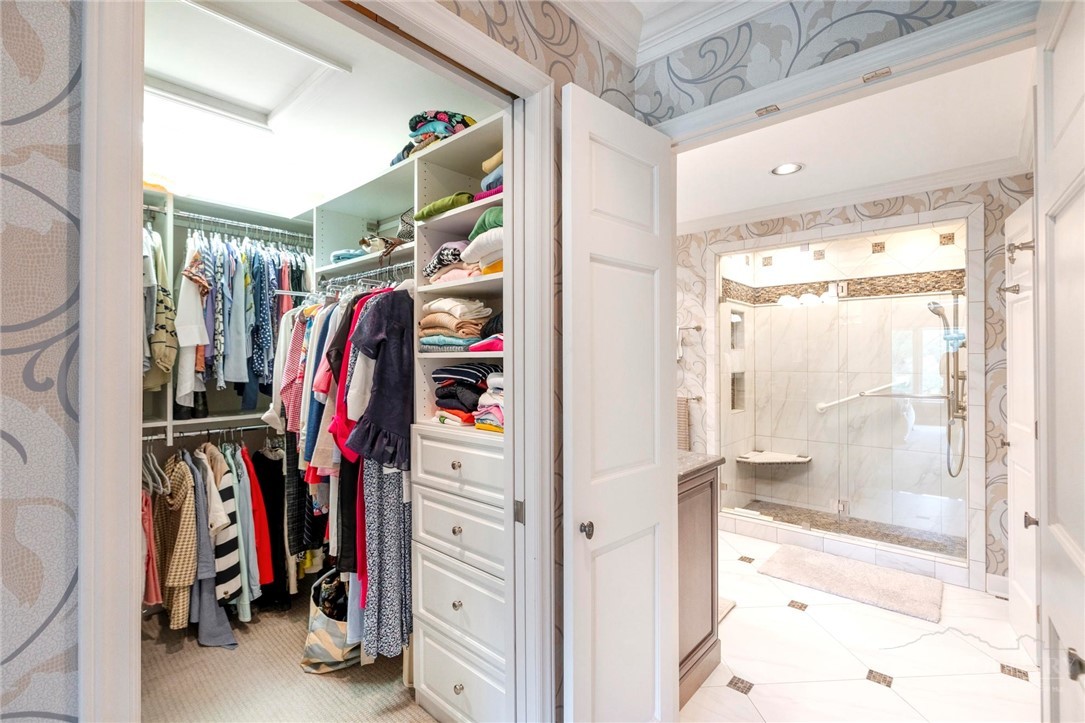 361 The Lakes, Unit C9 Boone, NC 28607 - Photo 23 of 47 a view of walk in closet with clothes and shoes