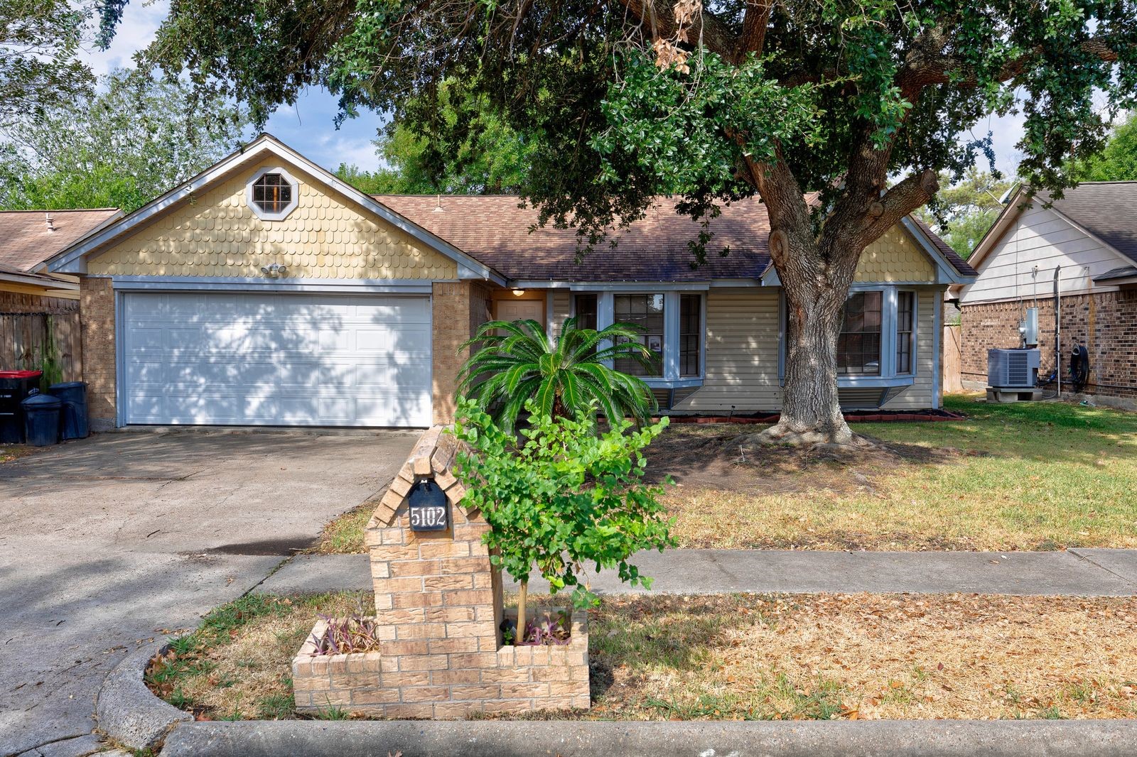 5102 Parsley Avenue Baytown, TX 77521 - Photo 1 of 19 a front view of a house with garden