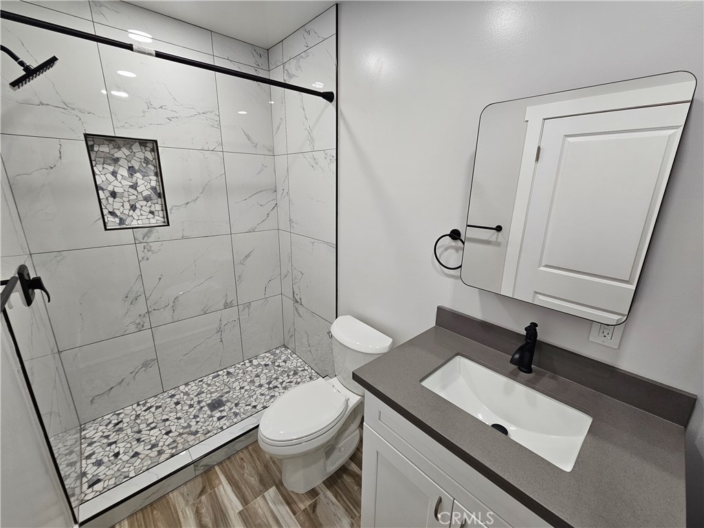 6570 Mt Diablo Avenue Riverside, CA 92506 - Photo 13 of 15 a bathroom with a sink toilet and shower