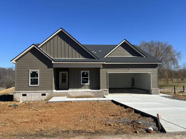 a front view of a house with yard