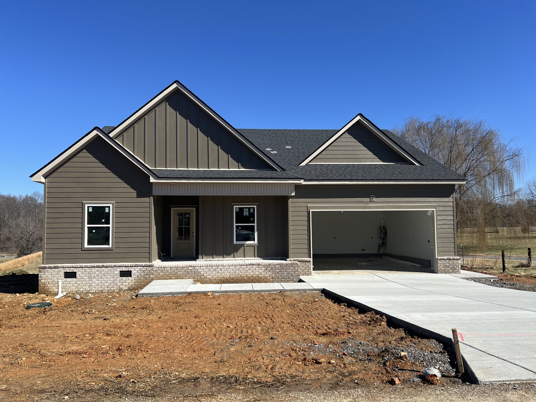 a front view of a house with yard