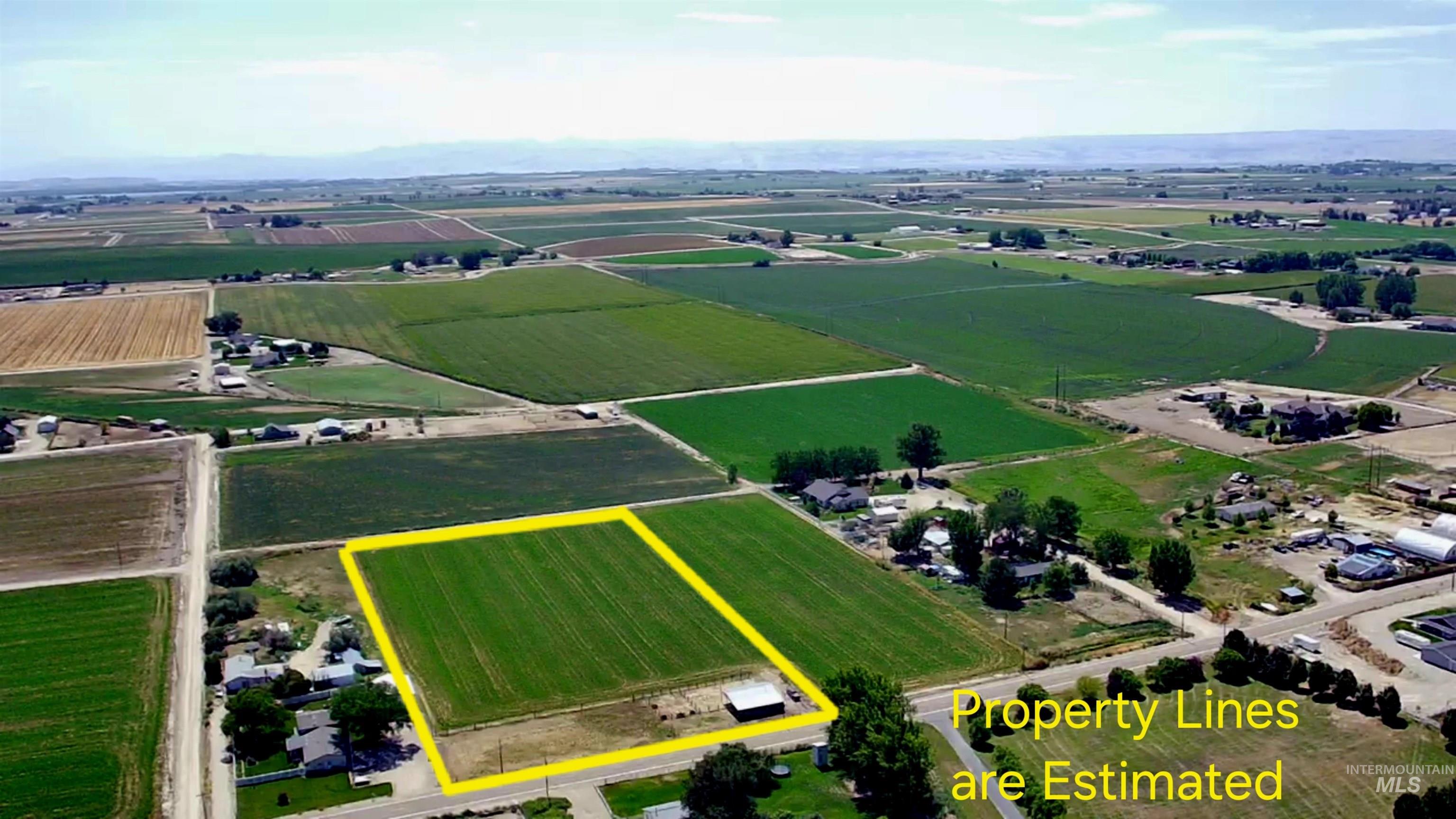 Aerial view of property's location with rural landscape and property parcel outlined