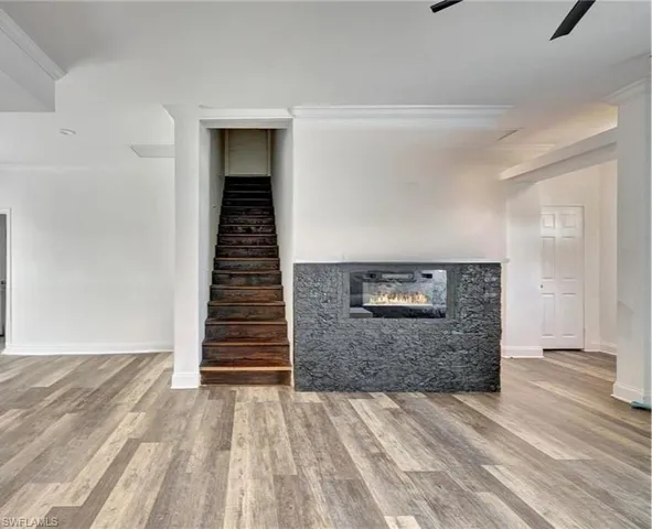 a view of a hallway with stairs