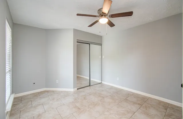 an empty room with fan