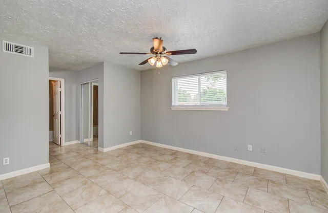 a view of a chandelier fan in a room