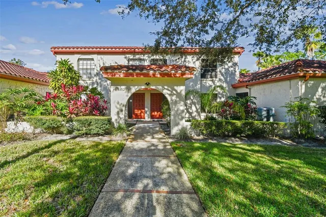 a view of a house with a yard