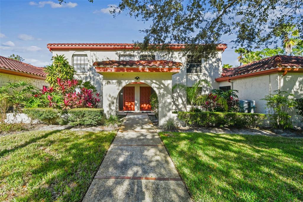 5352 Saddlebrook Way, Unit 4 Wesley Chapel, FL 33543 - Photo 1 of 1 a view of a house with a yard