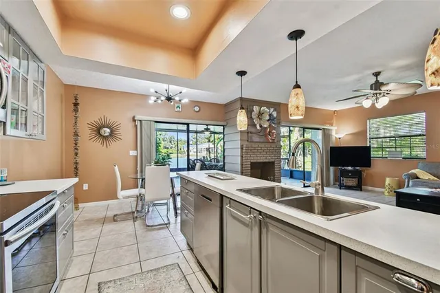 a kitchen with a sink appliances and cabinets