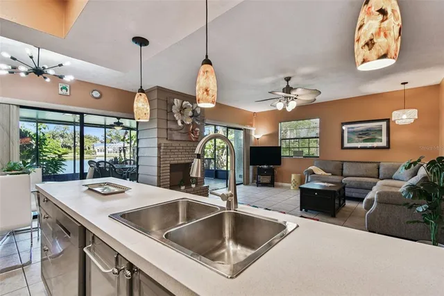 a dining room with furniture and a floor to ceiling window