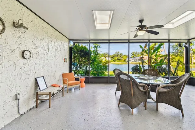 a bedroom with a bed and a window with a projector