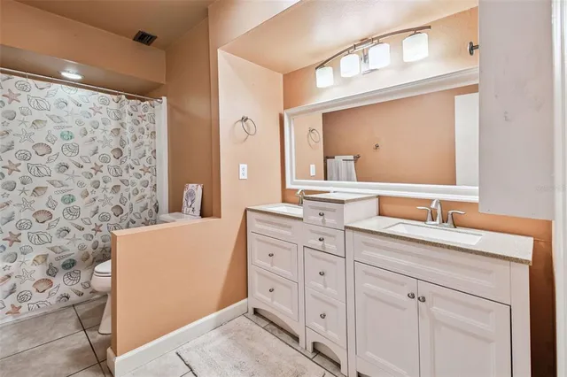 a view of a swimming pool with a yard and plants