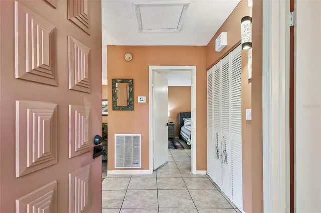 a view of a hallway with a livingroom and a dinning room stairs
