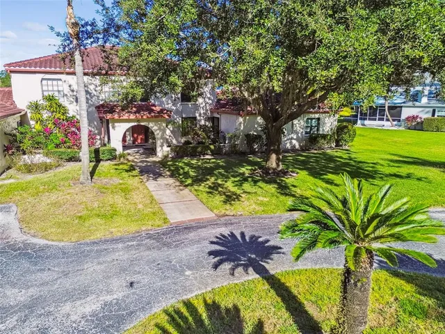 a pathway of a house with a yard