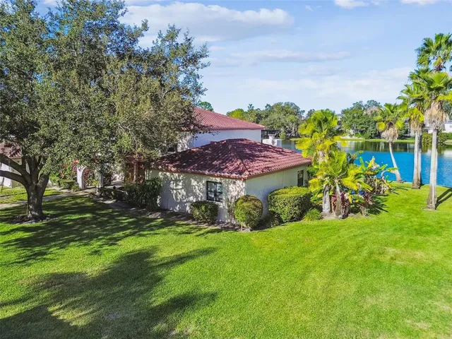 a front view of a house with a yard table and chairs