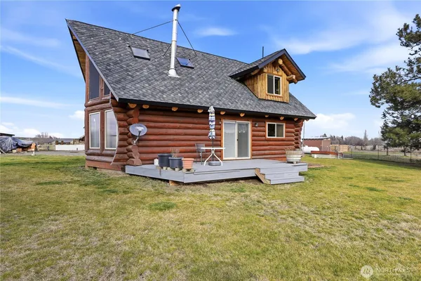 a view of a house with wooden deck