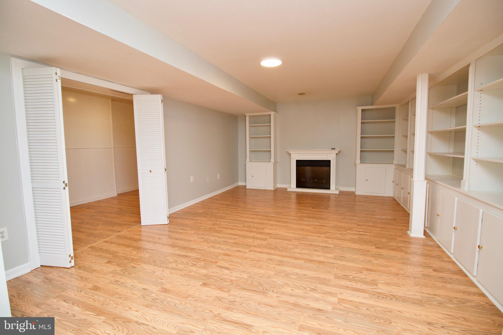 1805 Addison Court Frederick, MD 21701 - Photo 36 of 42 Basement with built in bookshelves
