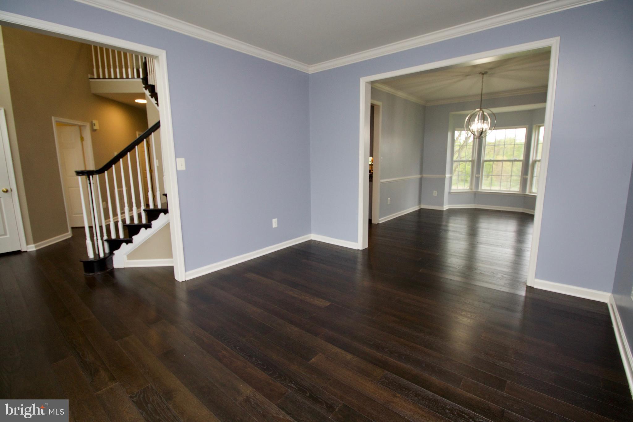 1805 Addison Court Frederick, MD 21701 - Photo 6 of 42 living room with view of foyer and dinning room