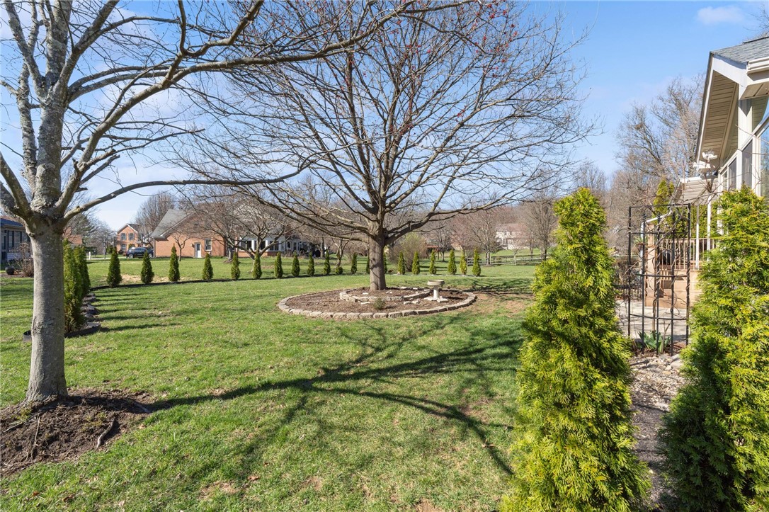 8781 Rupp Farm Drive West Chester, OH 45069 - Photo 43 of 48 This expansive, well-maintained lawn offers ample outdoor space with mature trees and thoughtful landscaping.