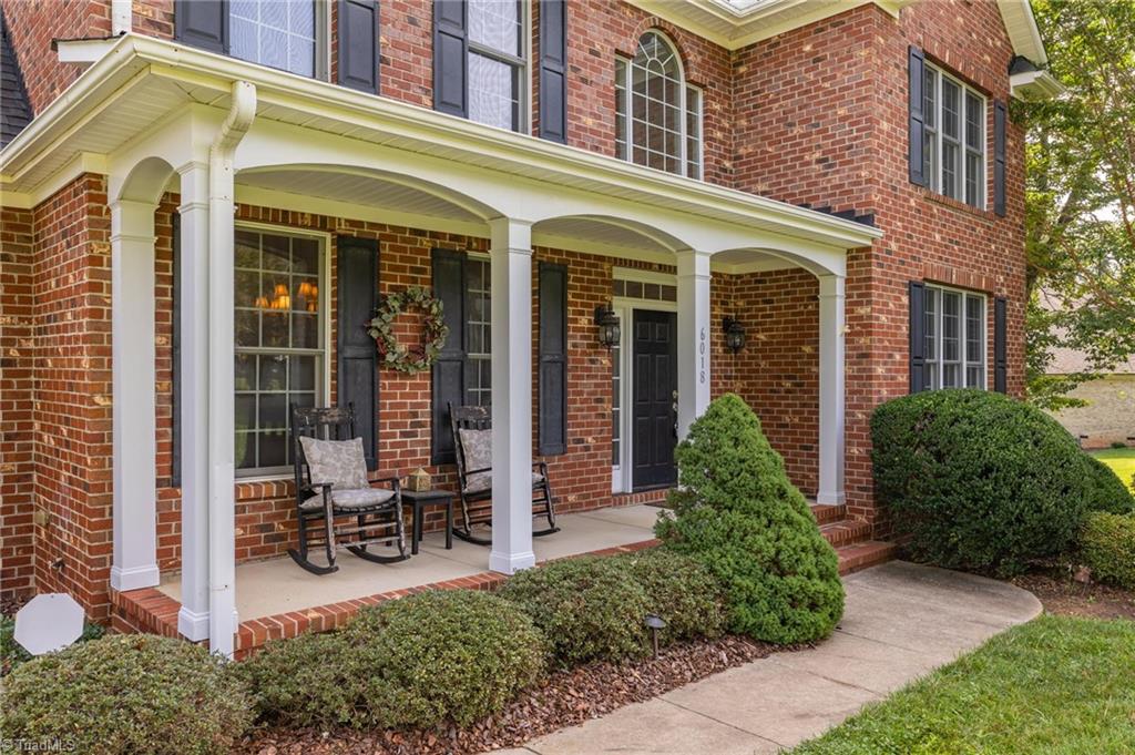 6018 Beckenham Way Oak Ridge, NC 27310 - Photo 3 of 50 ROCKING CHAIR FRONT PORCH