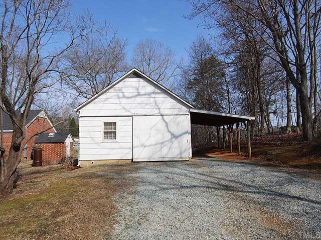 9923 North Roxboro Road Bahama, NC 27503 - Photo 12 of 12 a view of a house with a yard