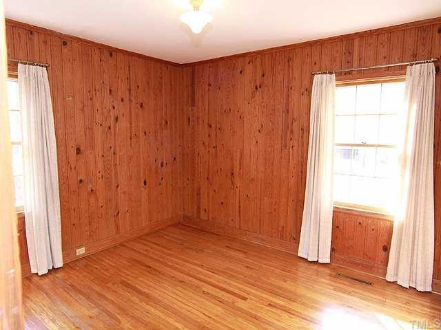 9923 North Roxboro Road Bahama, NC 27503 - Photo 10 of 12 an empty room with wooden floor and closet area