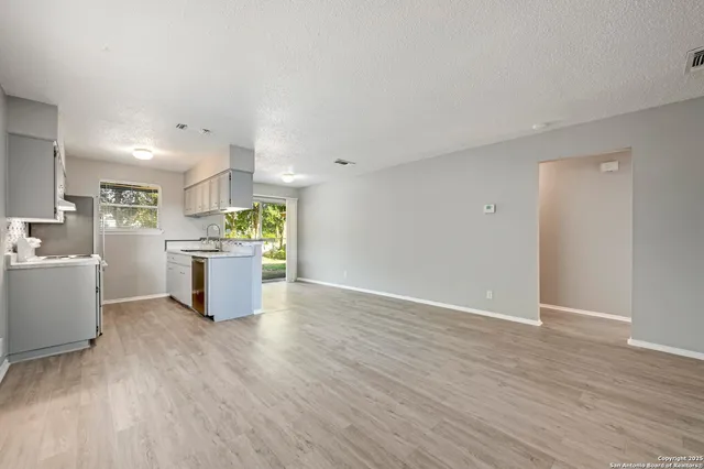 a view of kitchen with wooden floor