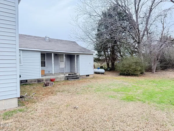 a backyard of a house with lots of green space