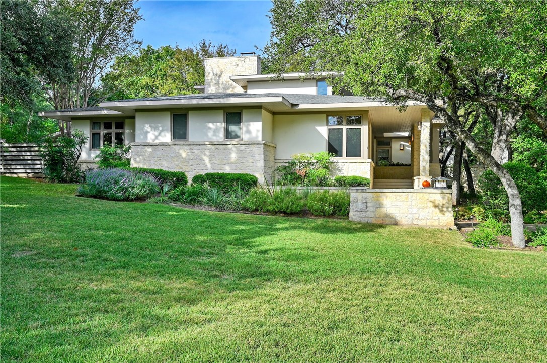 500 Lake Cliff Trail Austin, TX 78746 - Photo 1 of 1 a front view of house with yard and green space