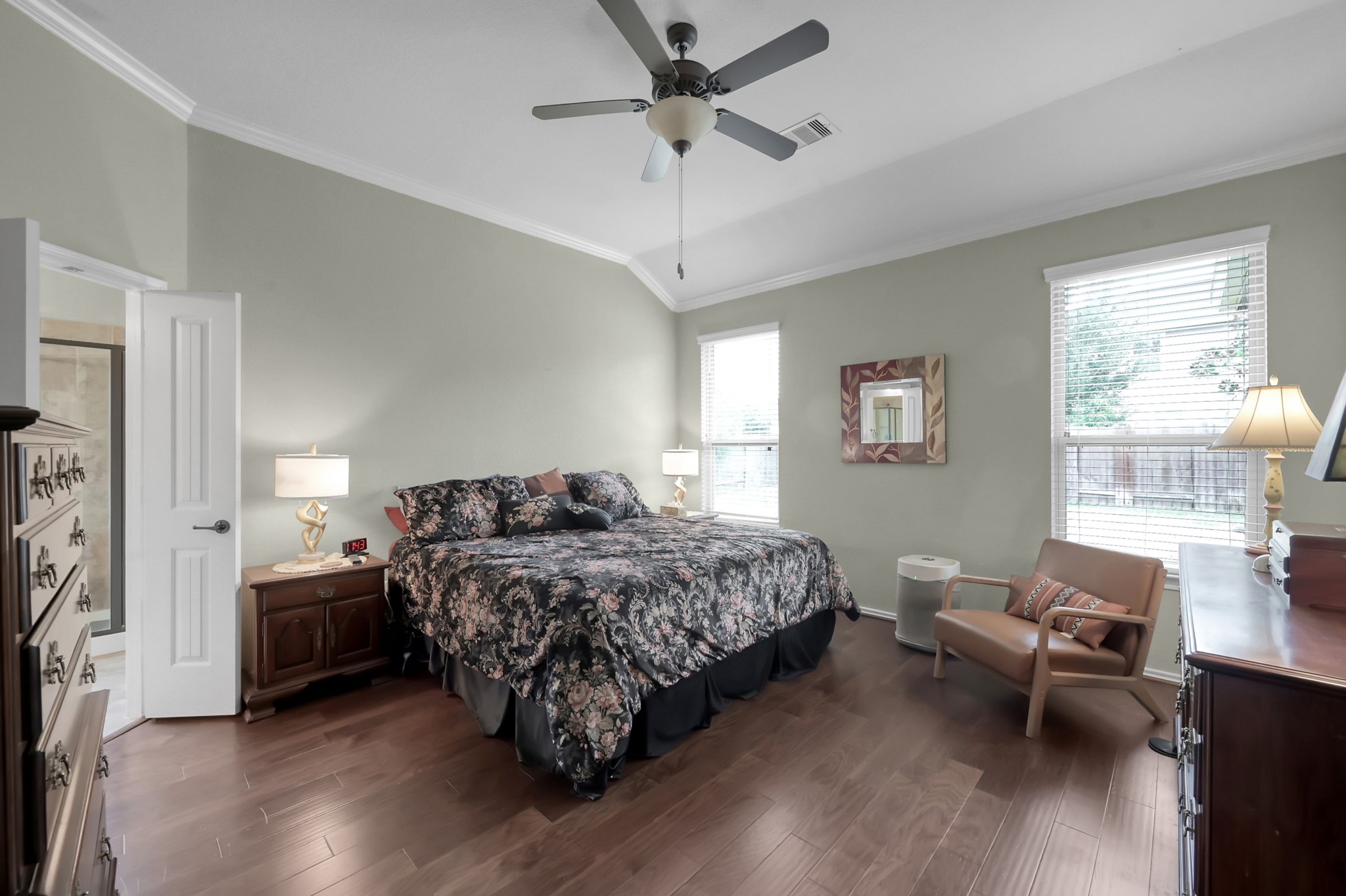 31718 Ravens Bluff Lane Spring, TX 77386 - Photo 23 of 39 Primary bedroom located downstairs. Lots of lighting, high ceilings, hard wood floors, with double doors to the bathroom