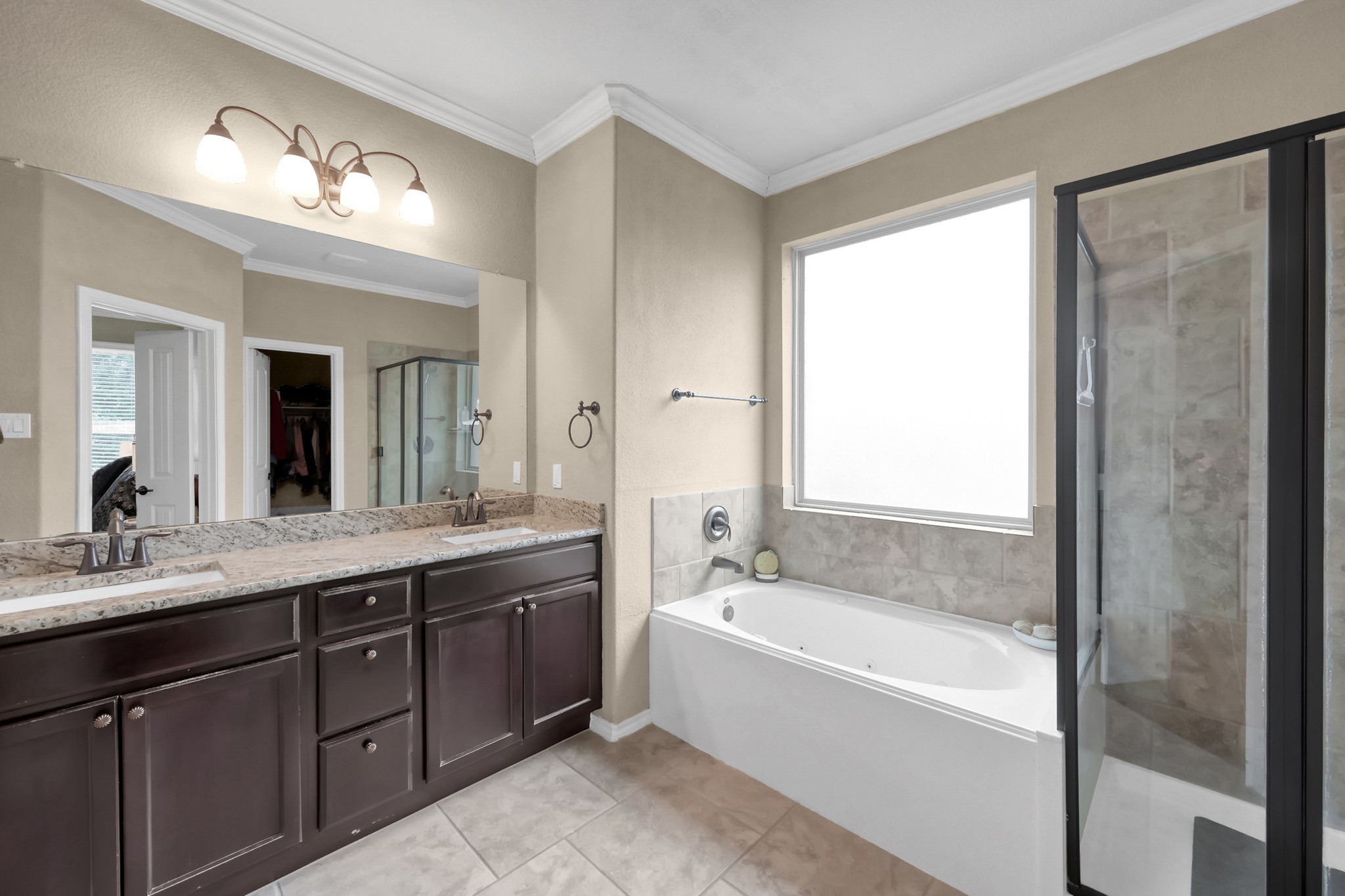 31718 Ravens Bluff Lane Spring, TX 77386 - Photo 25 of 39 Primary bath has separate tub and shower, dual sinks, linen closet, walk in closet