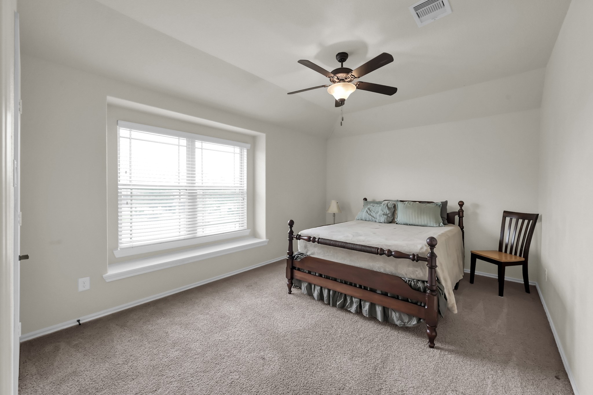 31718 Ravens Bluff Lane Spring, TX 77386 - Photo 29 of 39 Bedroom 1 has walk in closet, window seat, ceiling fan and carpet