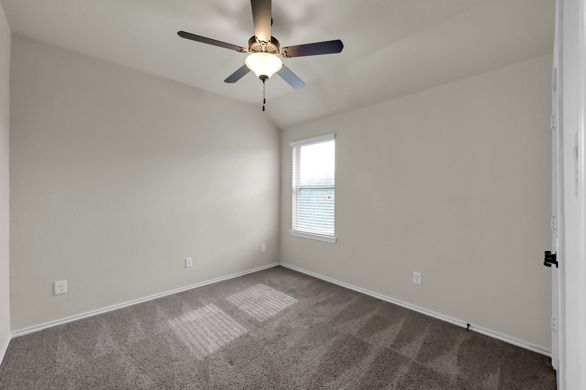 31718 Ravens Bluff Lane Spring, TX 77386 - Photo 34 of 39 Bedroom 3 has a double closet, ceiling fan and carpet