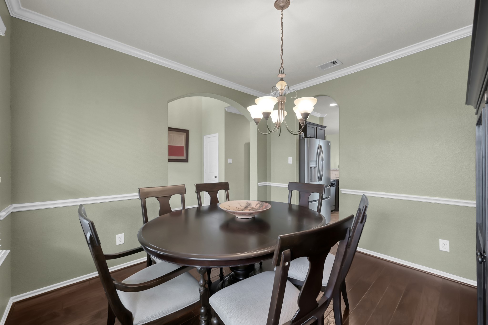 31718 Ravens Bluff Lane Spring, TX 77386 - Photo 8 of 39 Separate formal dining room with crown and chair rail molding, hardwood floors and natural lighting.