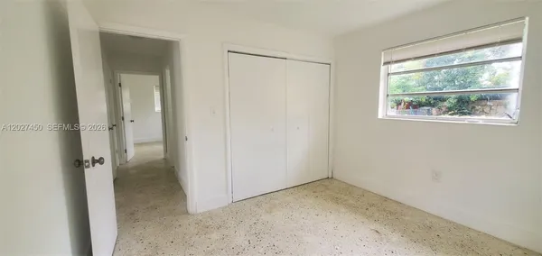 a view of an empty room with a window