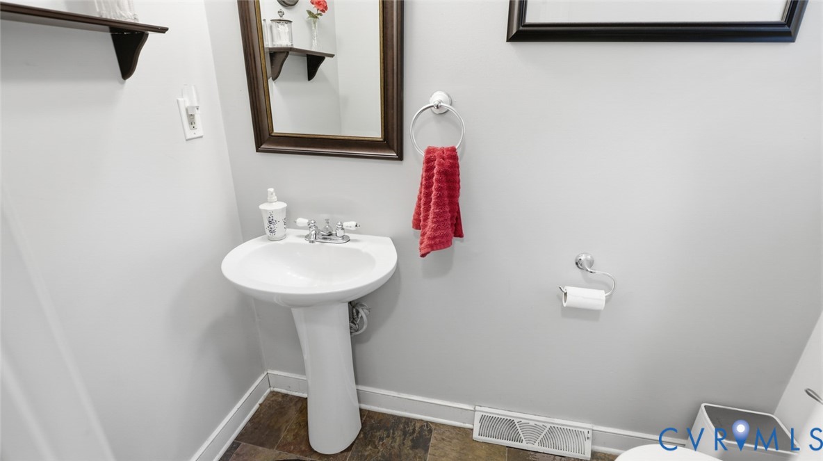 10716 Chalkley Road Richmond, VA 23237 - Photo 24 of 46 a bathroom with a sink and a mirror