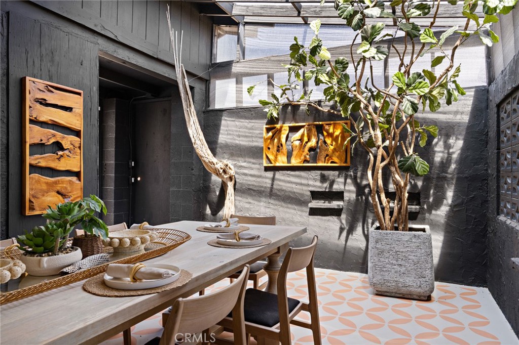 62420 Canterbury Street Joshua Tree, CA 92252 - Photo 15 of 50 a view of a dinning tables and chairs in a patio