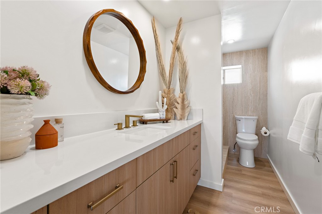 62420 Canterbury Street Joshua Tree, CA 92252 - Photo 21 of 50 a bathroom with a sink a toilet and a mirror