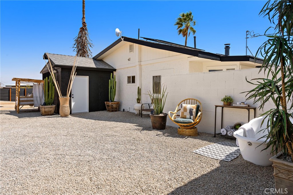62420 Canterbury Street Joshua Tree, CA 92252 - Photo 34 of 50 a view of the house with potted plants