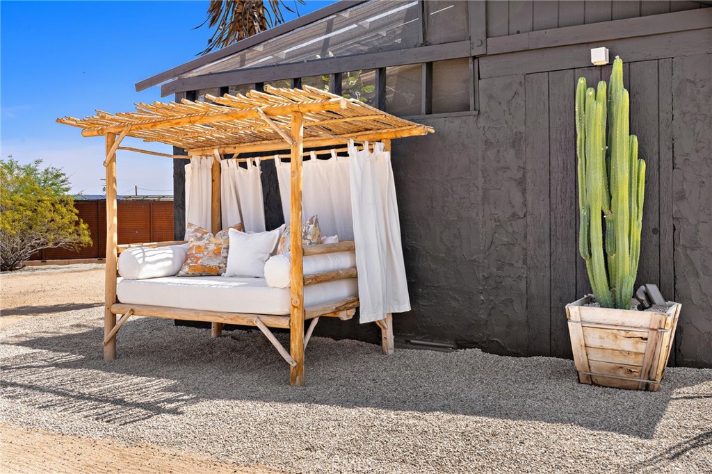62420 Canterbury Street Joshua Tree, CA 92252 - Photo 37 of 50 a outdoor space with a couch and swing