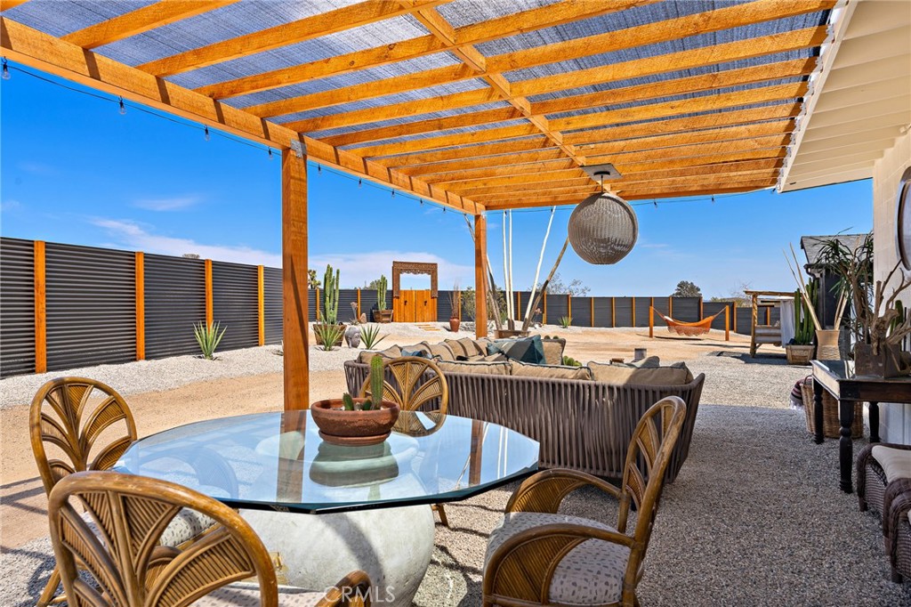62420 Canterbury Street Joshua Tree, CA 92252 - Photo 9 of 50 a dinning table and chairs in a room