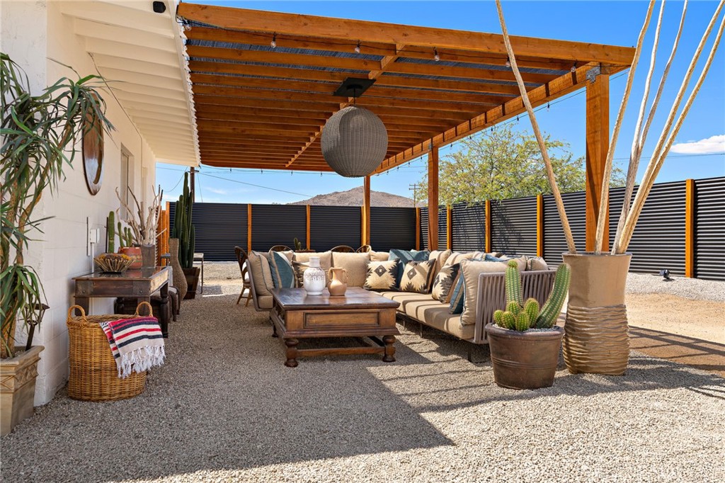 62420 Canterbury Street Joshua Tree, CA 92252 - Photo 10 of 50 a view of a patio with couches and potted plants