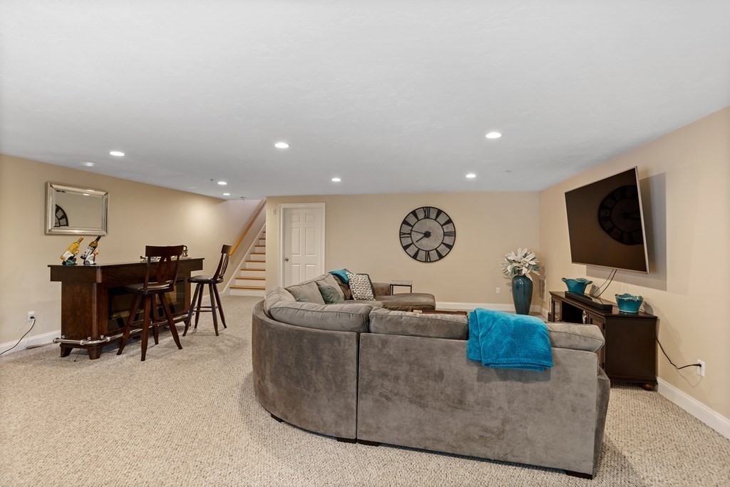 215 Rangeway Road, Unit 33 Billerica, MA 01862 - Photo 33 of 42 a living room with furniture and a flat screen tv