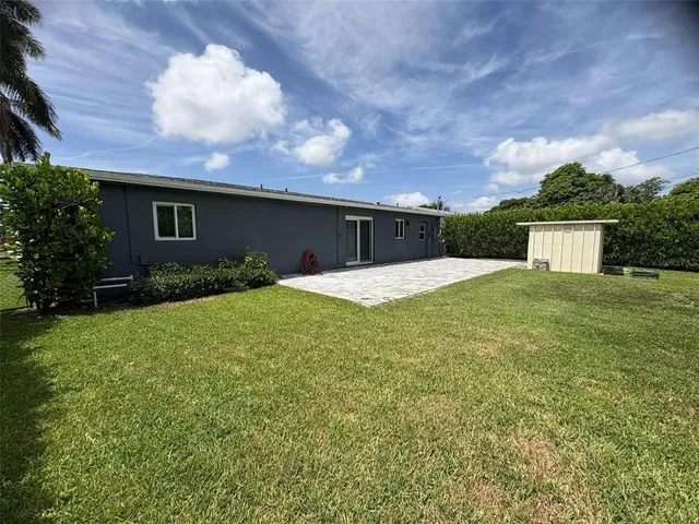 a view of a backyard of the house