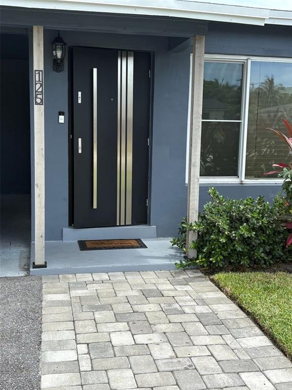 125 Southeast 6th Avenue Boynton Beach, FL 33435 - Photo 4 of 27 a view of a entryway door front of house