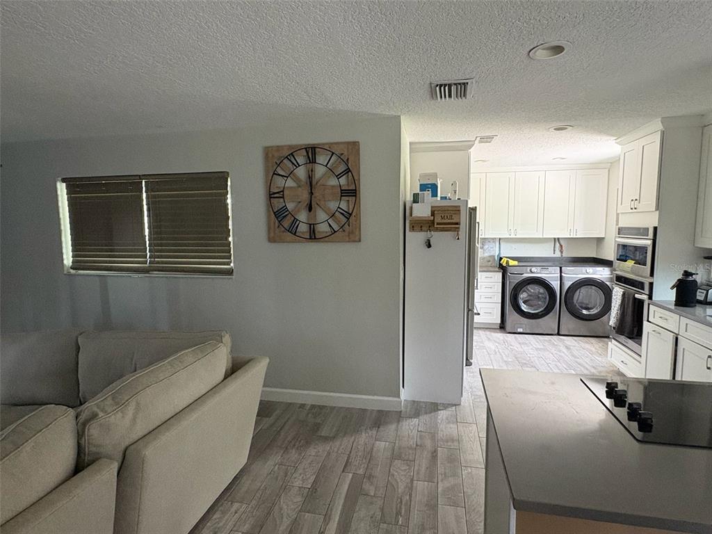 125 Southeast 6th Avenue Boynton Beach, FL 33435 - Photo 9 of 27 a living room with furniture and a wooden floor
